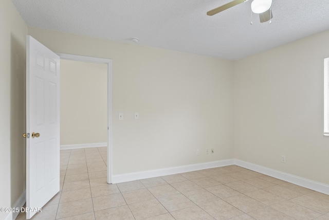 1518 Franklin Cir, Holly Hill, FL 32117 - unfurnished room with a ceiling fan, light tile patterned floors, baseboards, and a textured ceiling