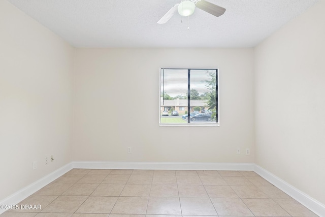 1518 Franklin Cir, Holly Hill, FL 32117 - empty room featuring ceiling fan, baseboards, a textured ceiling, and light tile patterned floors