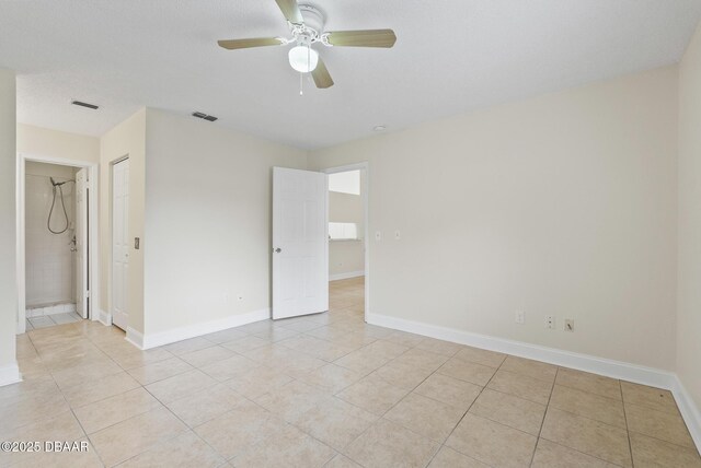 1518 Franklin Cir, Holly Hill, FL 32117 - empty room featuring light tile patterned floors, a ceiling fan, and baseboards