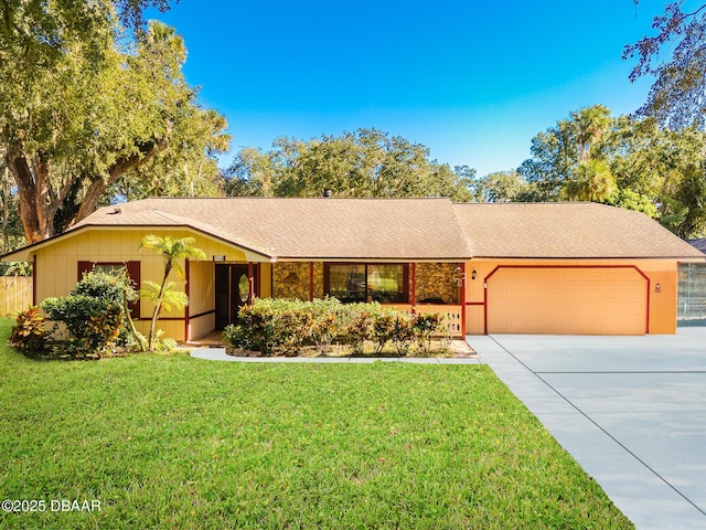 single story home with a garage and a front yard