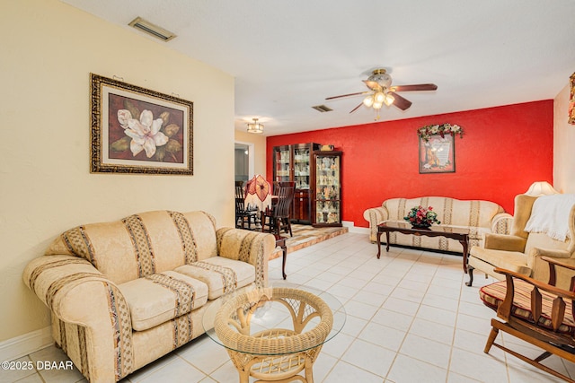 tiled living room featuring ceiling fan