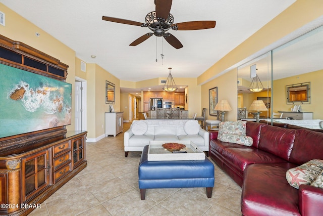 tiled living room featuring ceiling fan