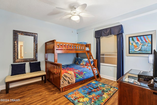 bedroom with wood-type flooring and ceiling fan