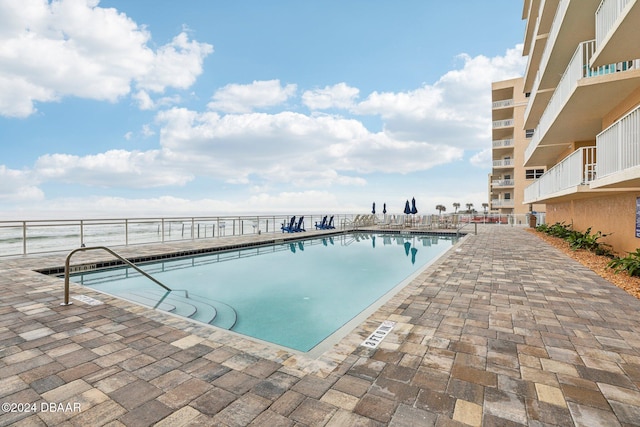 view of swimming pool featuring a patio