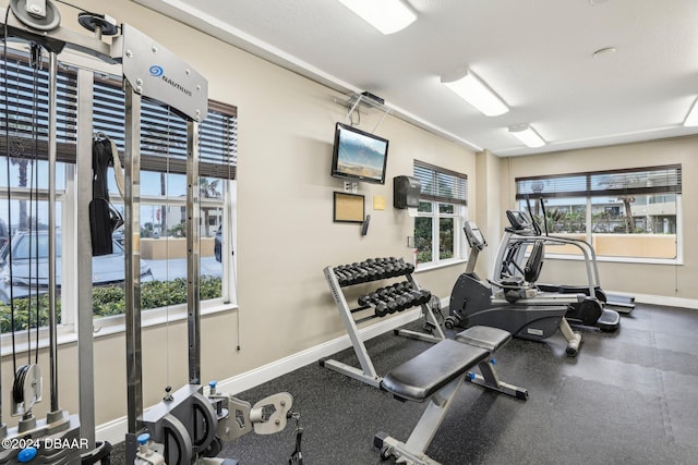 workout area featuring a wealth of natural light