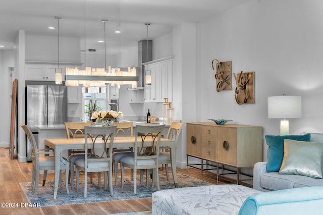 dining space with light hardwood / wood-style flooring