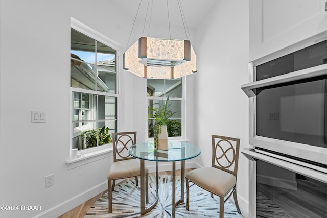 dining area with wood-type flooring