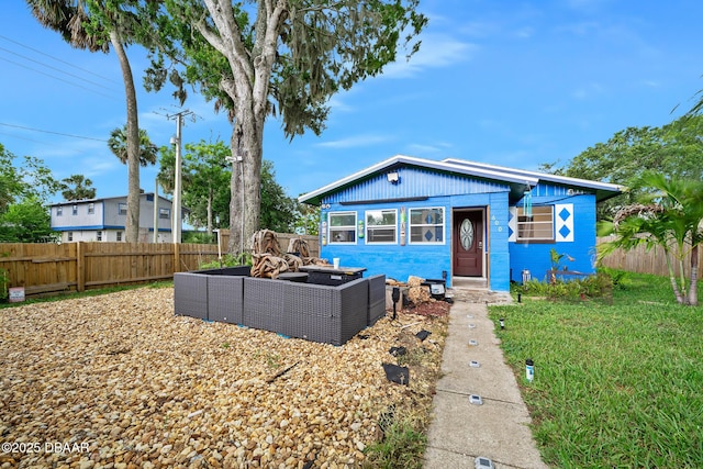 600 Holmes Ave, Daytona Beach, FL 32114 - bungalow-style home with an outdoor hangout area and a fenced backyard