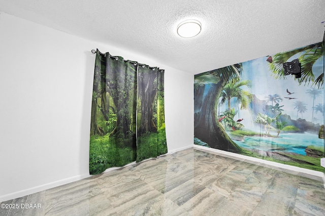 600 Holmes Ave, Daytona Beach, FL 32114 - empty room featuring a textured ceiling and baseboards