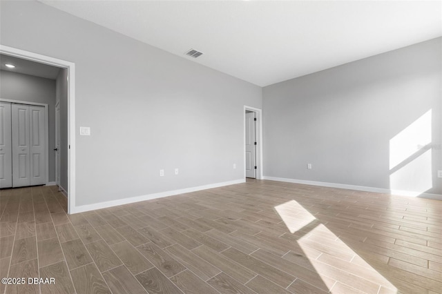 23 Weymouth Ln, Palm Coast, FL 32164 - unfurnished room featuring wood finished floors and recessed lighting