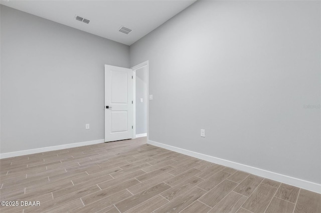 23 Weymouth Ln, Palm Coast, FL 32164 - empty room with light wood-type flooring and baseboards