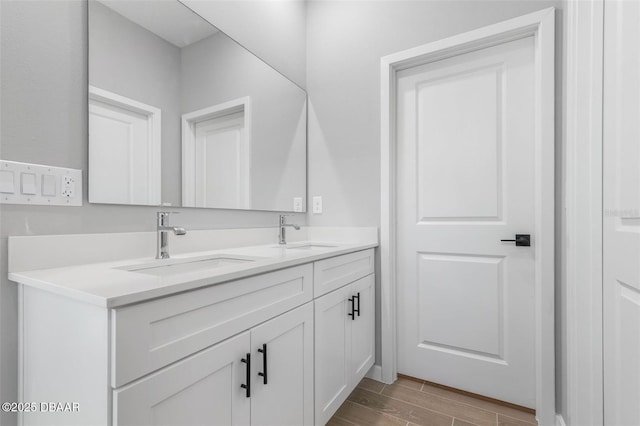 23 Weymouth Ln, Palm Coast, FL 32164 - full bathroom featuring double vanity and wood tiled floors