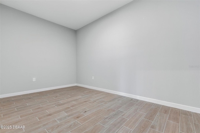 23 Weymouth Ln, Palm Coast, FL 32164 - unfurnished room with light wood-style flooring and baseboards