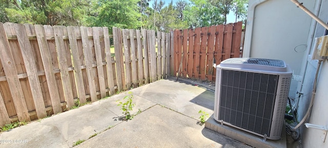 exterior space featuring fence and central air condition unit