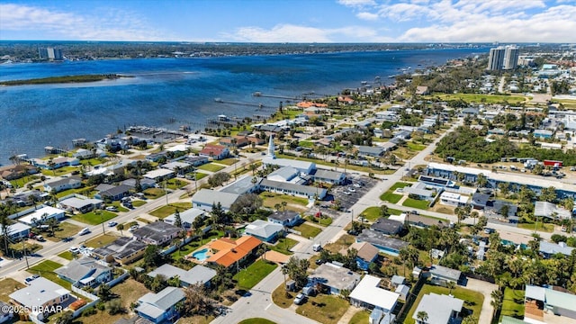 drone / aerial view featuring a water view and a residential view