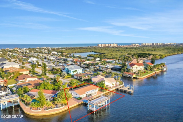 drone / aerial view with a water view