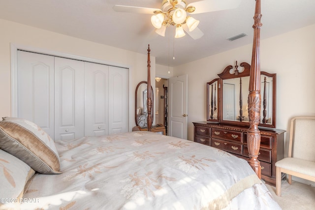 bedroom with ceiling fan and a closet