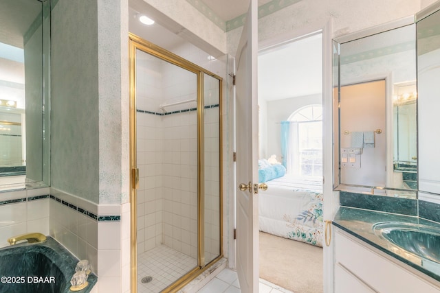 bathroom with walk in shower and vanity