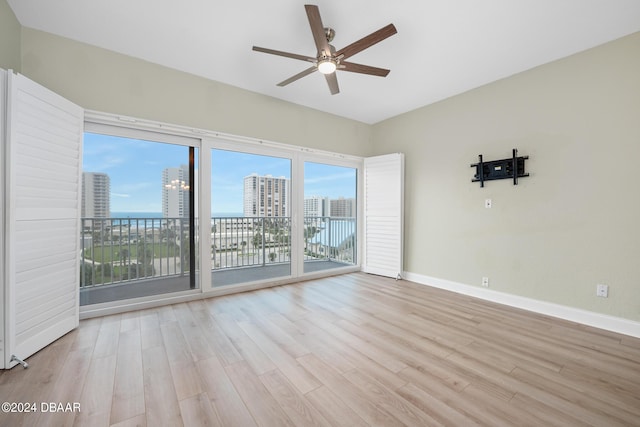 2 Oceans W Blvd Unit 707, Daytona Beach, FL 32118 - spare room with ceiling fan, wood finished floors, and baseboards