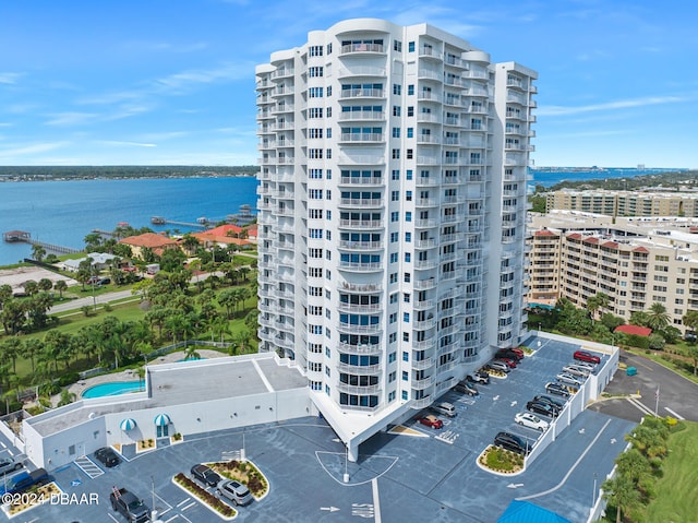 birds eye view of property with a water view