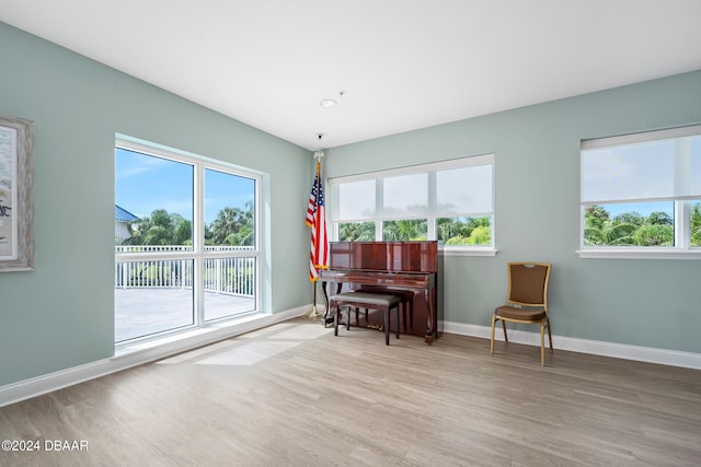 2 Oceans W Blvd Unit 707, Daytona Beach, FL 32118 - living area with wood finished floors, plenty of natural light, and baseboards