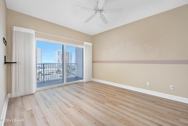 2 Oceans W Blvd Unit 707, Daytona Beach, FL 32118 - empty room with wood finished floors, baseboards, and a ceiling fan