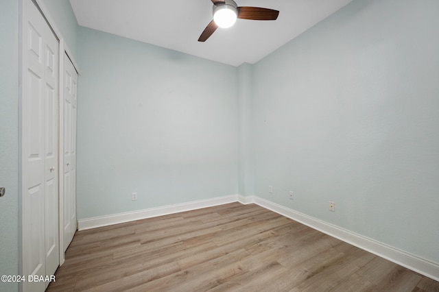 unfurnished bedroom with a closet, ceiling fan, and light wood-type flooring