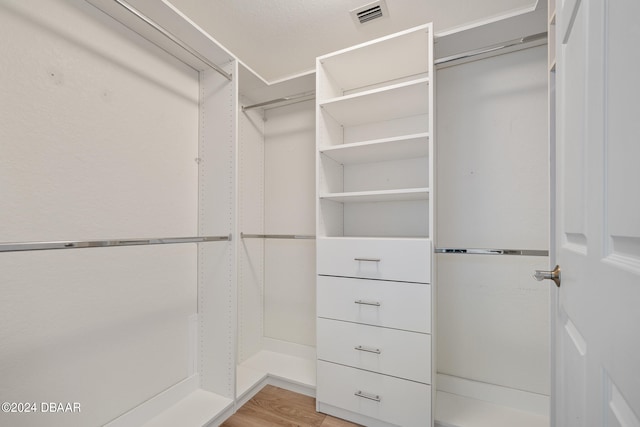 spacious closet featuring light wood-type flooring