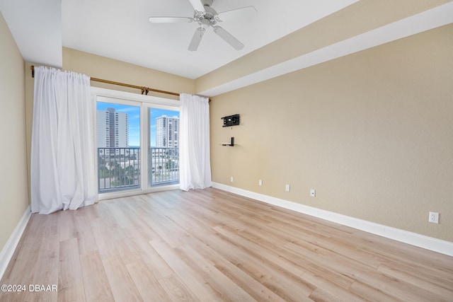 unfurnished room with light hardwood / wood-style floors and ceiling fan