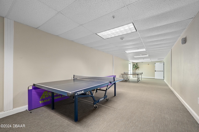 game room featuring carpet floors and a paneled ceiling