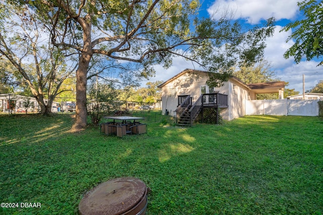 view of yard featuring a wooden deck