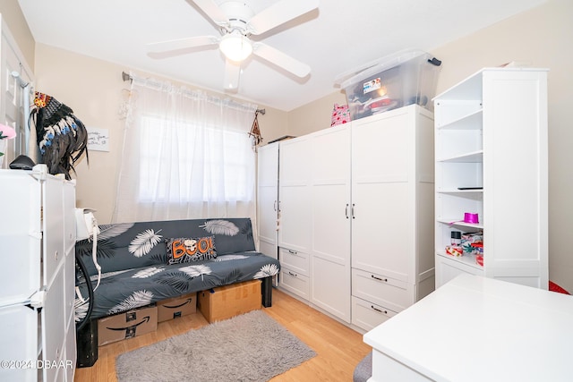 interior space with ceiling fan and light hardwood / wood-style flooring