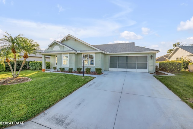 ranch-style home featuring a front yard and a garage