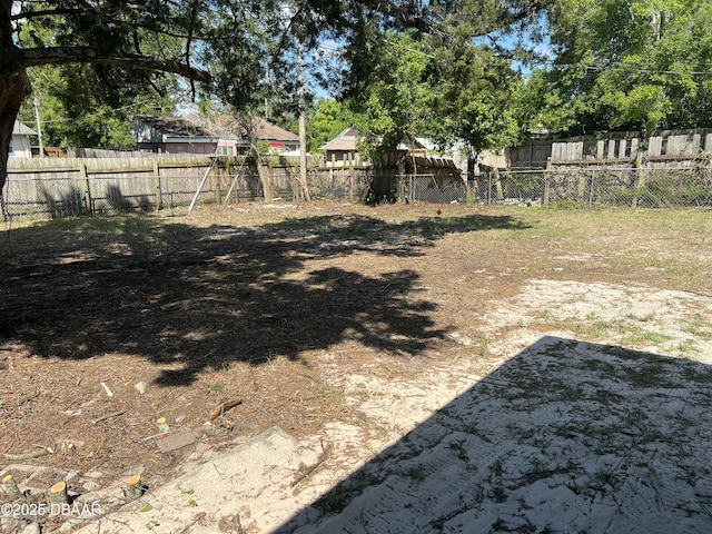 view of yard with a fenced backyard