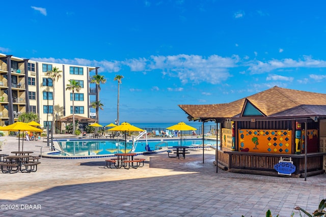 view of swimming pool featuring a patio area