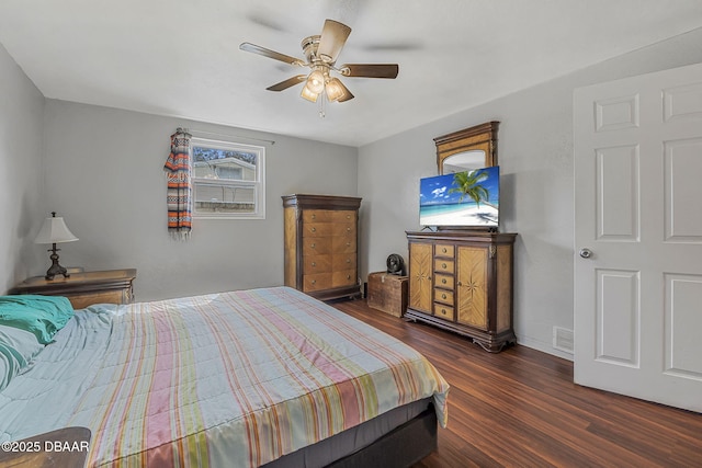 bedroom featuring dark hardwood / wood-style floors and ceiling fan