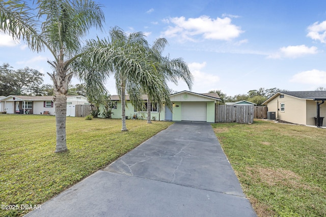 view of front of property with a garage and a front lawn