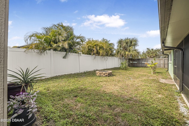 view of yard featuring a fire pit