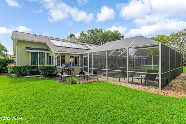 67 Kingsley Ln, Ormond Beach, FL 32174 - rear view of property featuring an outdoor pool, roof mounted solar panels, a chimney, a patio area, and a lawn