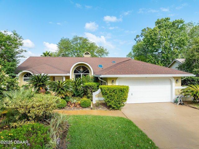 67 Kingsley Ln, Ormond Beach, FL 32174 - ranch-style home with a front yard, roof with shingles, stucco siding, an attached garage, and driveway