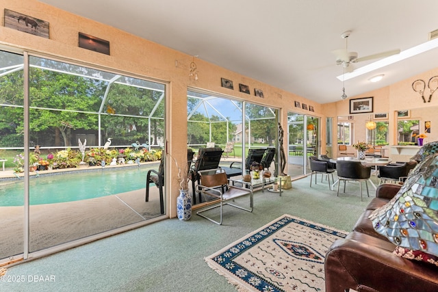 67 Kingsley Ln, Ormond Beach, FL 32174 - carpeted living area featuring a sunroom, ceiling fan, vaulted ceiling, and visible vents