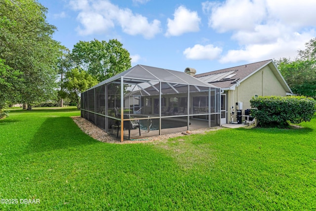 67 Kingsley Ln, Ormond Beach, FL 32174 - rear view of property with a lanai, stucco siding, and a yard
