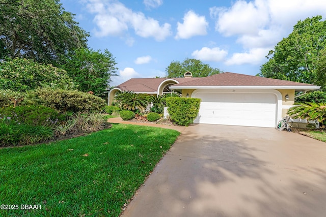 67 Kingsley Ln, Ormond Beach, FL 32174 - ranch-style house featuring stucco siding, an attached garage, driveway, and a front lawn