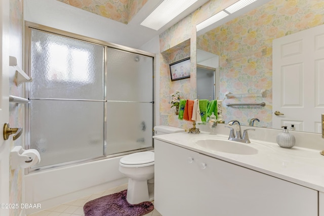 67 Kingsley Ln, Ormond Beach, FL 32174 - bathroom with tile patterned flooring, vanity, toilet, and wallpapered walls