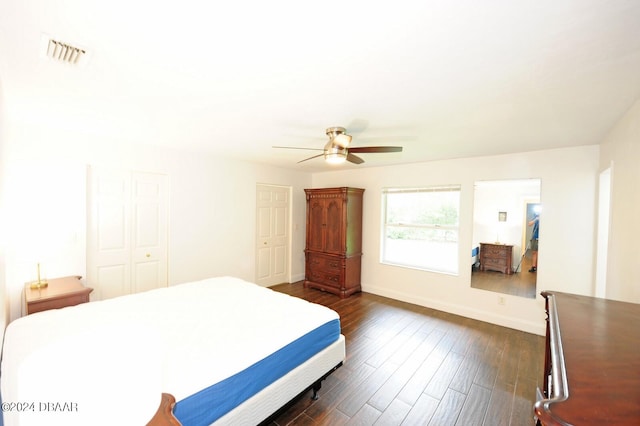 bedroom featuring dark wood-type flooring and ceiling fan