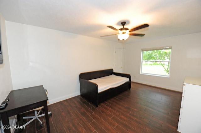 living area with dark hardwood / wood-style floors and ceiling fan