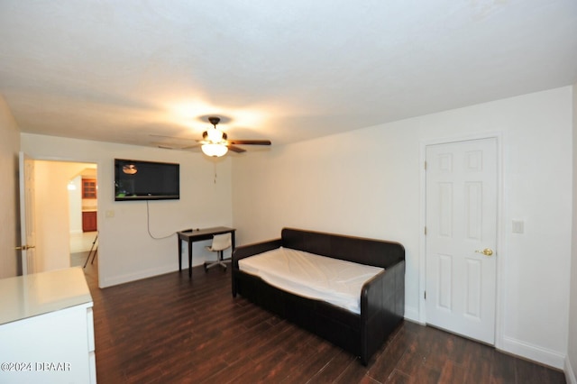 bedroom with ceiling fan and dark hardwood / wood-style flooring