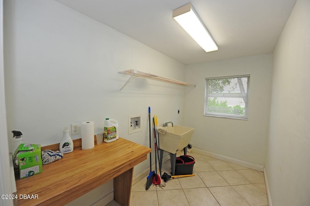 laundry area with washer hookup, light tile patterned floors, and electric dryer hookup