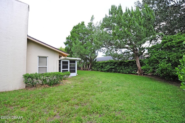 1889 Seclusion Dr, Port Orange, FL 32128 - view of green lawn featuring a sunroom