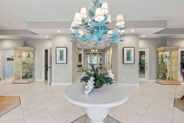 foyer featuring baseboards, recessed lighting, a chandelier, and crown molding